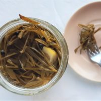 An opened jar of pickled rock samphire