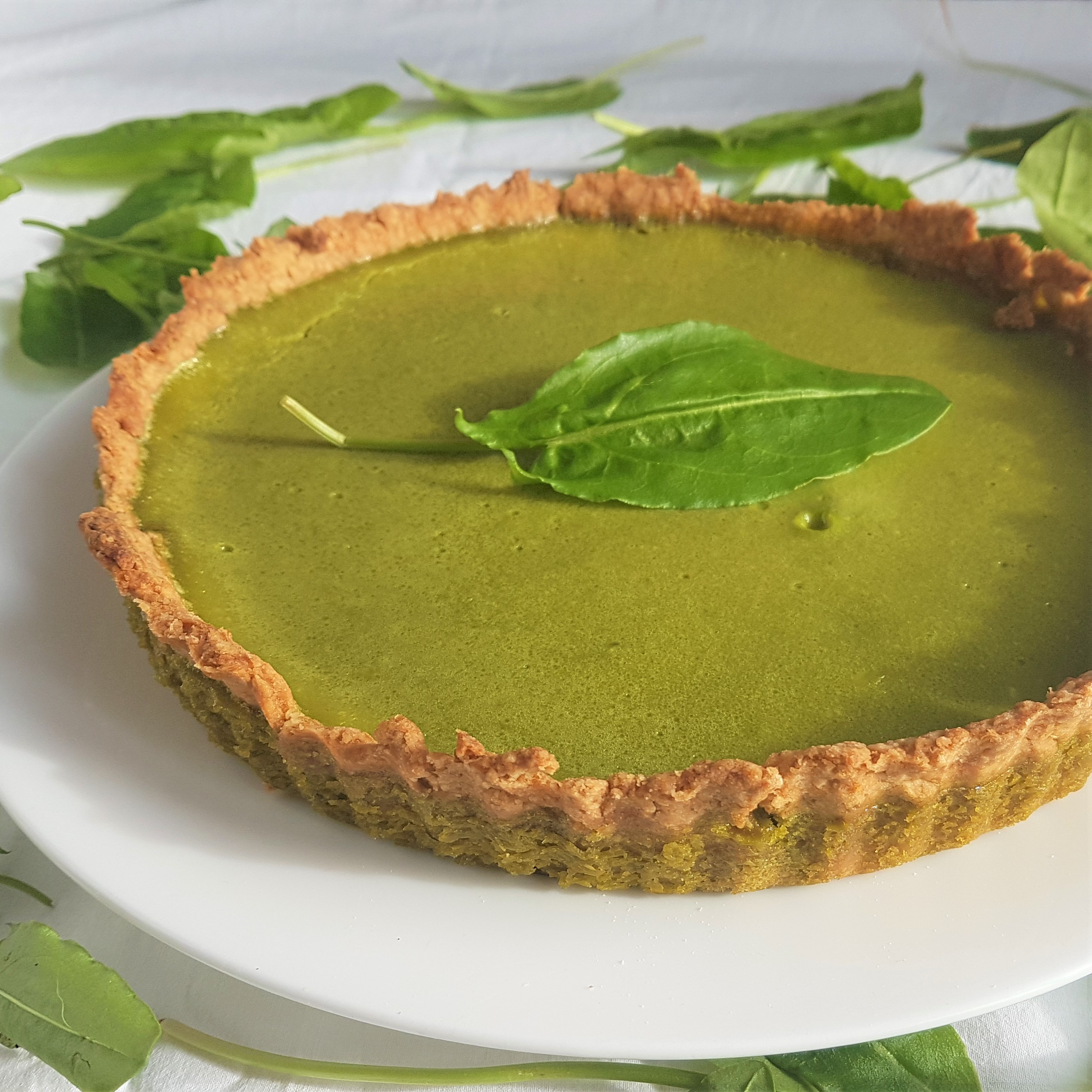 freshly baked green sorrel t decorated with wild, foraged sorrel leaves