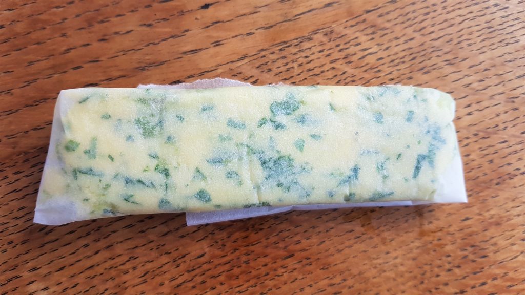 Wrapped herb butter ready to freeze