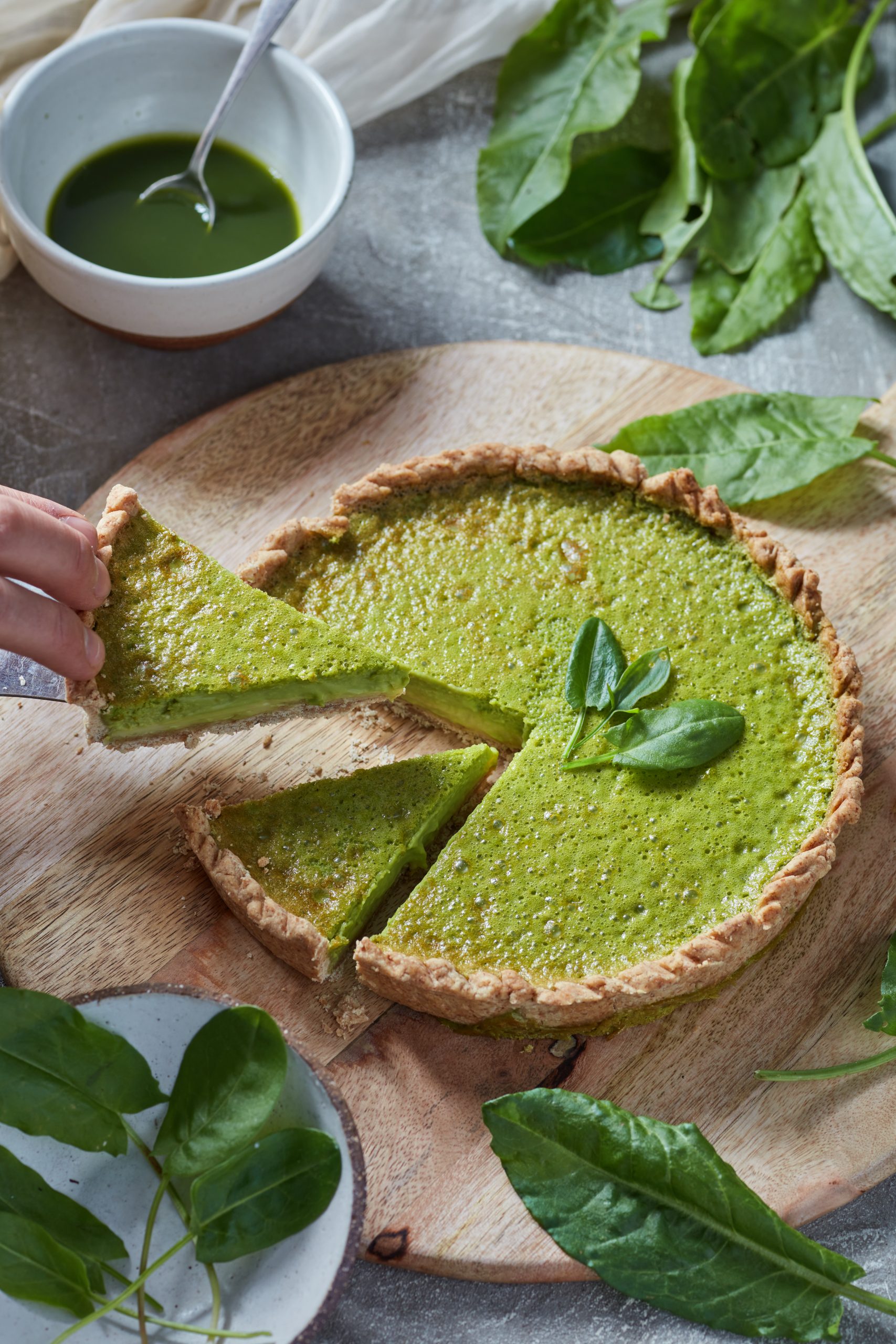 taking a slice of a wild sorrel tart for a foraging event