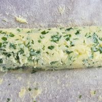 A roll of freshly made Spring wild herb butter