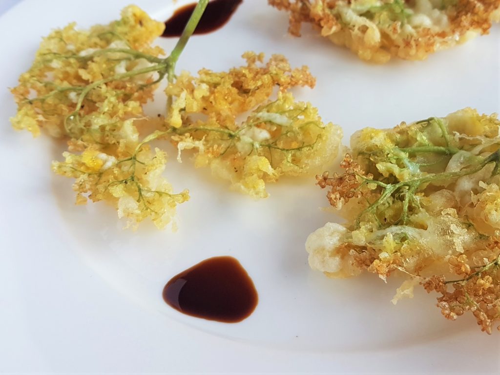 Serving elderflower fritters with soy sauce