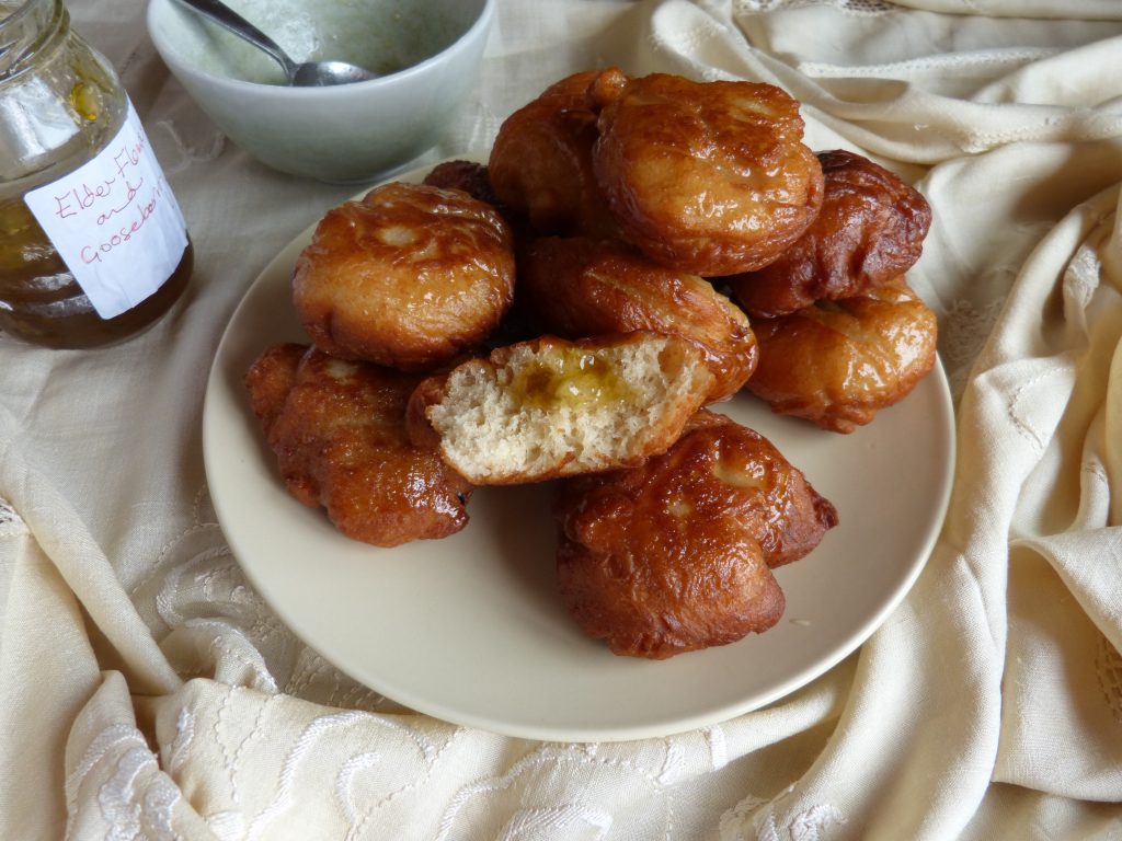 Plate of freshly made homemade elderflower jam doughnuts