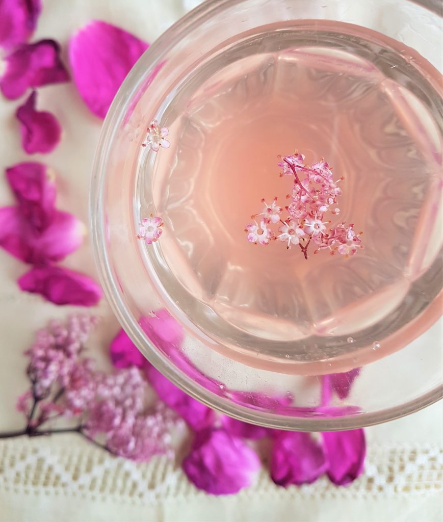 Glass of pink elder and rose cordial