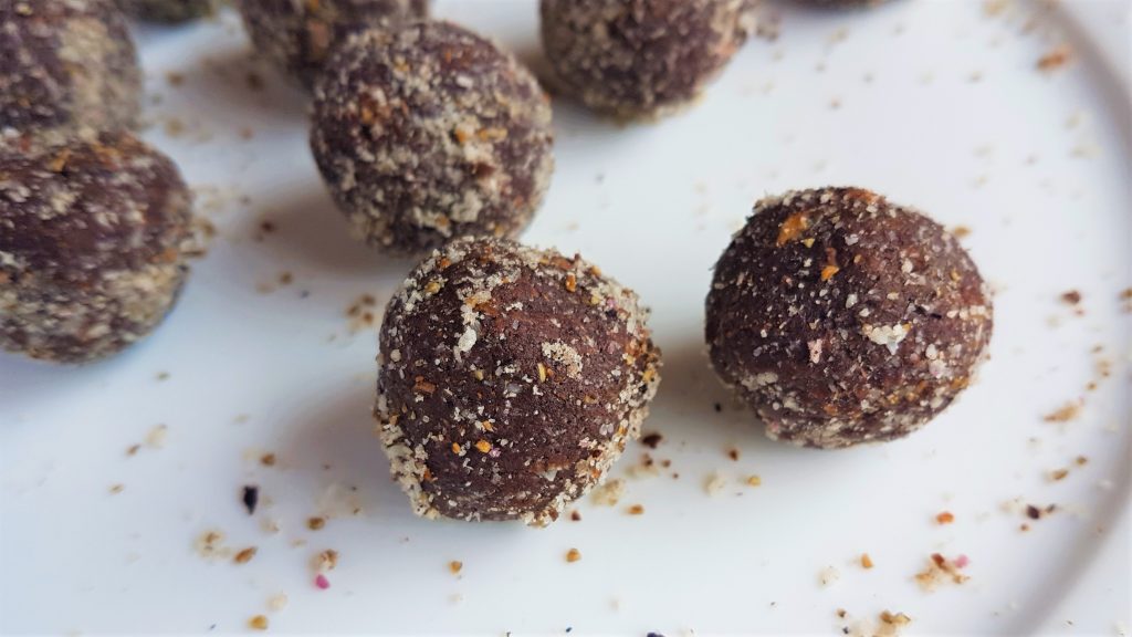 Freshly rolled alexander seed and coconut raw truffles 