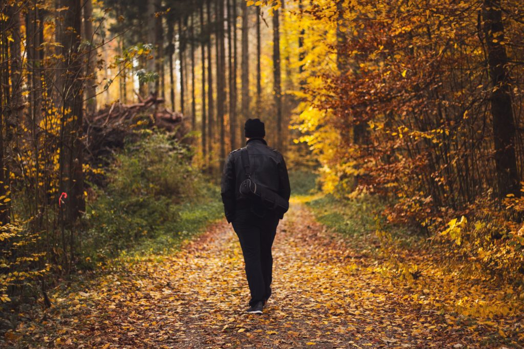 Man walking through the woods
