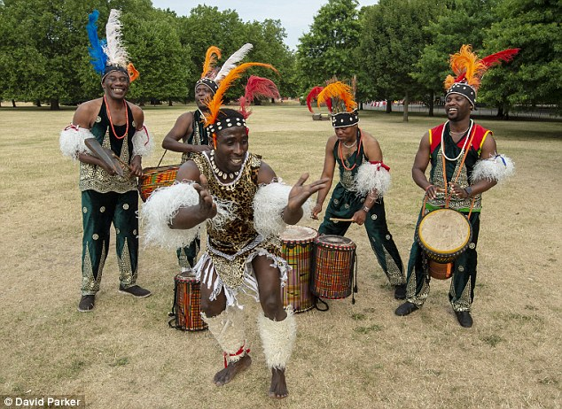 Adanta dance group from Nigeria performing a 'rain dance' in Hyde park, London to help overcome the parched grass dominating the area